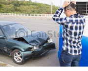 Stressed Driver looking the car After Traffic Accident