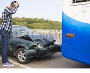 Stressed Driver looking at car After Traffic Accident on the road
