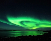 Aurora Australis lights up the night sky over the Australian Antarctic Territory, 11 March 2007. The new glacial ice Wilkins Runway situated 65kms from the Australian research station of Casey will allow Australian scientists to greatly expand their studies on the effects climate change is having on Antarctica's fragile environment by providing 20-30 flights from Hobart each summer.  AFP PHOTO/AUSTRALIAN ANTARCTIC DIVISION/Frederique OLIVIER