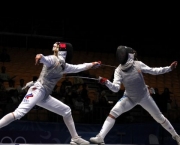 SINGAPORE, 15 Aug 2010 - Victoria Alekseeva of Russia (L) competes with Camila Mancini of Italy during the Cadet Female Individual Foil final at the Singapore 2010 Youth Olimpic Games in Singapore, August 15, 2010.  Camila Mancini  won by 15-9 and got the gold medal.
XINHUA/SYOGOC-Pool/Zhang Chuanqi