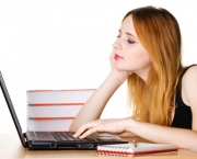 Young girl surfing the internet at her laptop