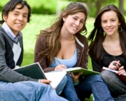 college or university students studying outdoors