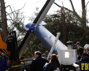 The wreckage of Continental Connection Flight 3407 is seen in Clarence, NY - Feb 16, 2009 - Photo: David Duprey-Pool/Getty Images