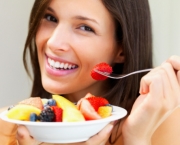 Woman eating fresh fruit