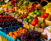 Fresh fruit stand with boysenberries, raspberries, cherries and grapes