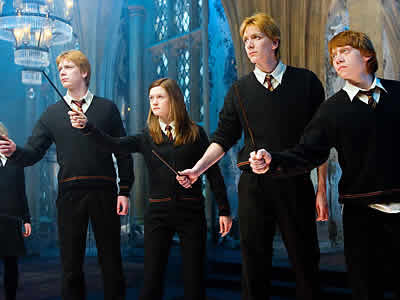 Rupert Grint como Ronald Weasley e os irmãos Weasley
